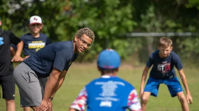 Blugold coaching student with youth players 