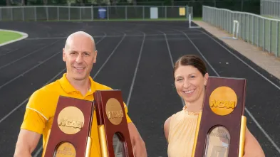 Blugold track and volleyball champion coaches