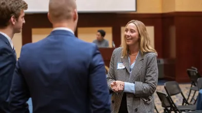 students and employers talking at COB event 