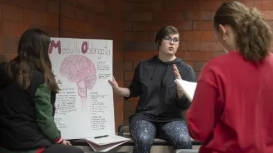 student presenting in psychology 100 class