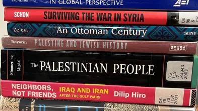 stack of text books about the Middle East