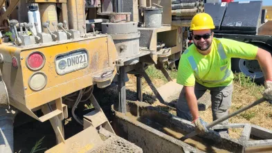 male geology student working with mining machinery