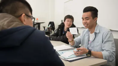 Chinese students with English flashcards