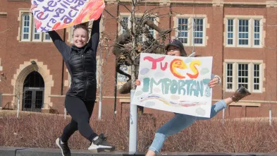 French students jumping by Sprites with signs in French 