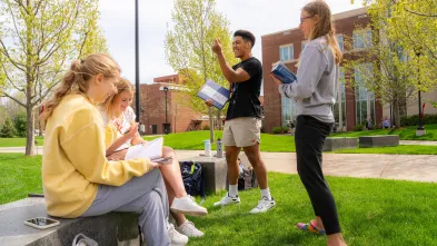 students outdoors for math class, laughing 