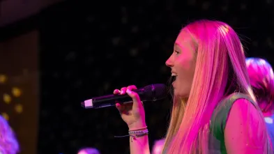 Close up of a student singing during A Capella Extravaganza 