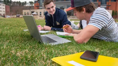 Finance students studying outside