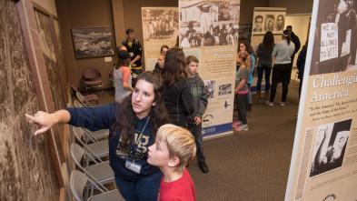 public museum exhibit with kids and adults