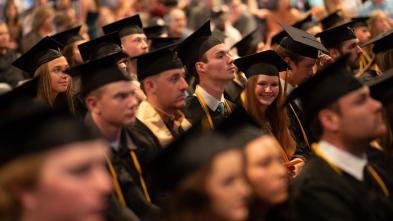 grads in the crowd at commencement 