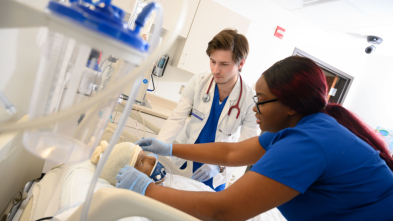 Nursing students participate in a care simulation