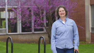 Daria Hutchinson standing outside library breezeway 