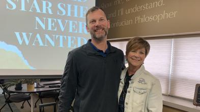 Man and woman pose for a photo in the Center for Excellence in Teaching and Learning