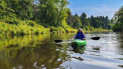 Lyndsie Vickers in kayak on Eau Claire river 