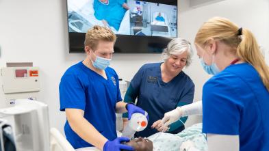 Students and dean in nursing SIM lab