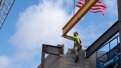 beam being set in place atop the science building