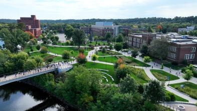 drone shot of campus from river