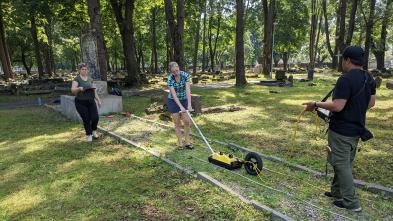 students using ground radar in old cemetery
