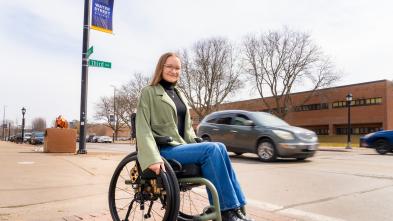 Becca Roth on Water St in wheelchair 