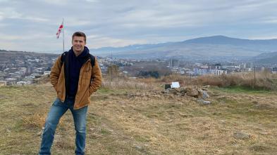 McCullen Willmert stands overlooking a Georgian hillside
