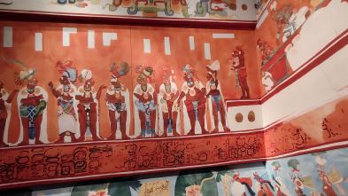 A colorful mural portraying a group of people from Latin America.