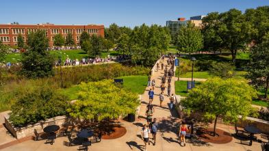 Students walking on campus on a sunny fall day