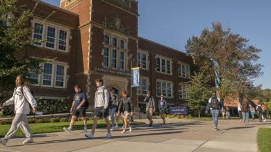 Campus mall with Schofield Hall in fall