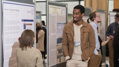 Male student presenting research at CERCA poster event