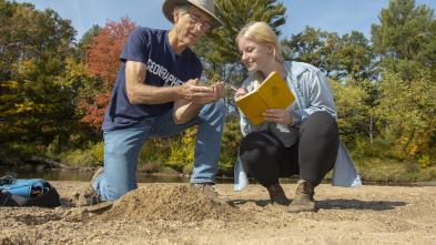 Dr. Douglas Faulkner, professor of geography, and Grace Bowe, an environmental studies major, examine the banks of western Wisconsin rivers as part of a faculty-undergraduate student research project. (Photo by Shane Opatz)