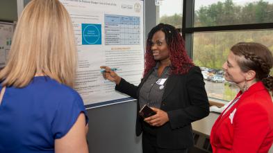 Grad student presents research poster