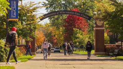 students under the archway at UWEC, fall scene