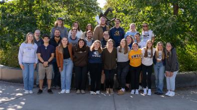 Group of CJ 251 students lined up and smiling at the camera.