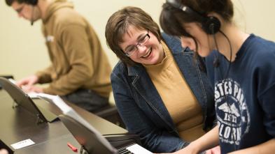 Professor Cruciani works with student on piano skills Professor Cruciani works with student on piano skills