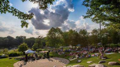 Music lovers in Eau Claire enjoying the Sounds Like Summer Concert Series in Phoenix Park.