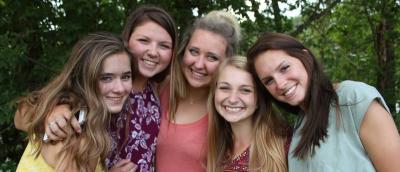 Members of Alpha Xi Delta sorority smiling as a group