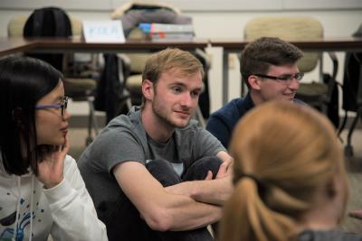 Students sitting in a circle listening to each other