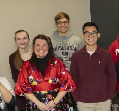four students in a Chinese class during a dumpling making culture lesson 