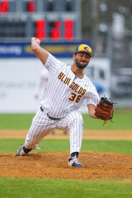 Travis Thompson pitching in Blugold baseball game 