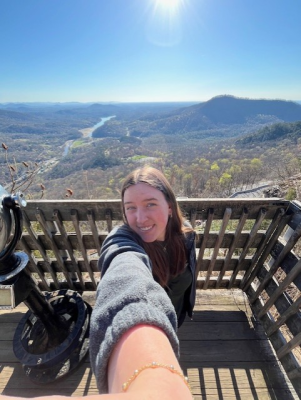 Selfie of student in a mountain landscape.