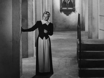 Nun looks around the corner