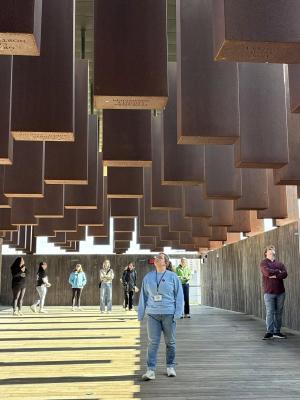 A student browses at a museum during the 2025 Civil Rights Pilgrimage.