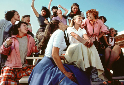 Group of women talking on the football stadium bleachers