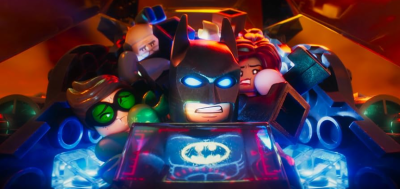 Lego Batman, Robin and other smushed into the Batmobile.