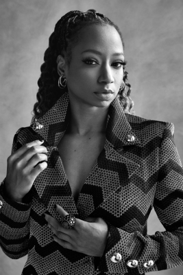 Monique Coleman in a striped blazer.