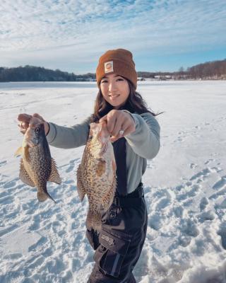 Jenny Anderson and two fish from ice fishing 