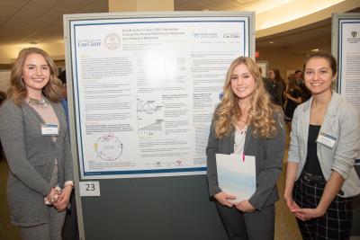 students with poster at Rotunda