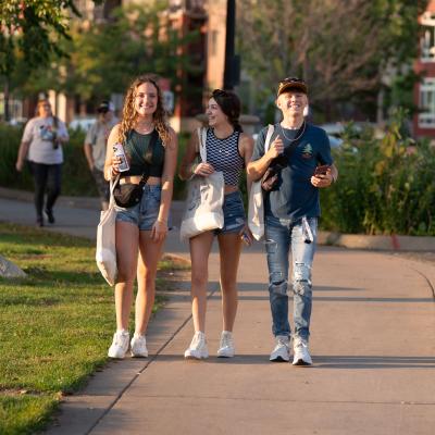 Students walk down the sidewalk at the annual UWEC meets EC event.