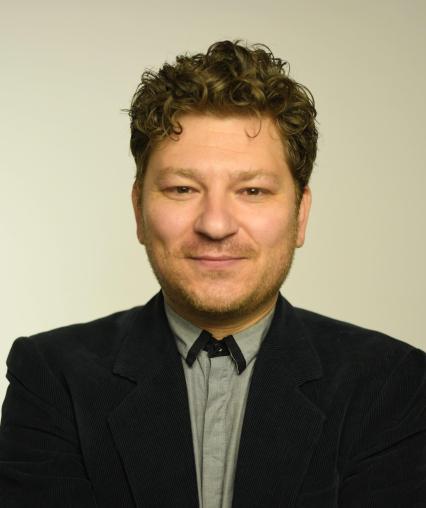 Photograph of Dr. Krichevsky in grey shirt and blue blazer