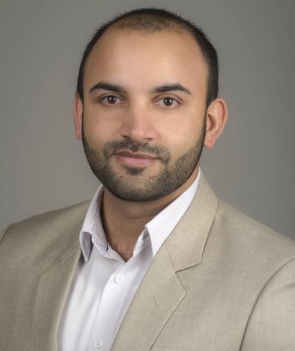 A portrait of Dr. Bhagat, a professor of Information Systems.