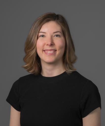 Picture of Katie Streckert, a young woman with shoulder length brown hair and light skin