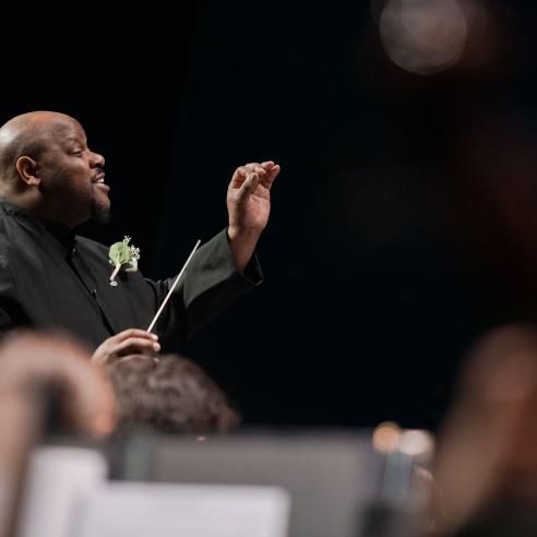 A picture of a choral director